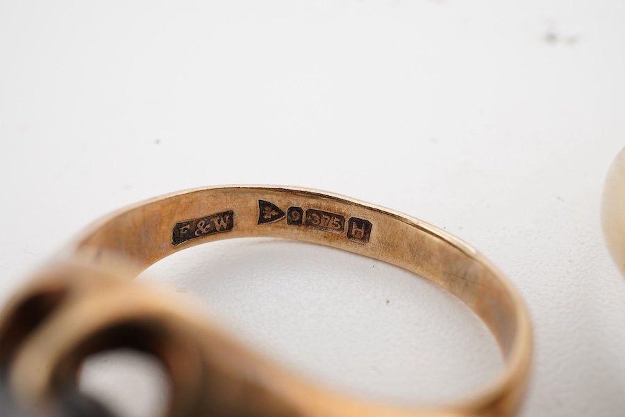 Two gem-set rings, early 20th century, one set with an oval citrine, the other with an oval garnet, each mounted in 9ct gold, sizes M1/2 and N respectively, each with British hallmark, combined gross weight approximately